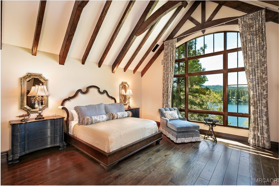 28087 North Shore Road Lake Arrowhead, CA 92352 - Photo 18 of 48 a bedroom with a bed and a large window with outer view