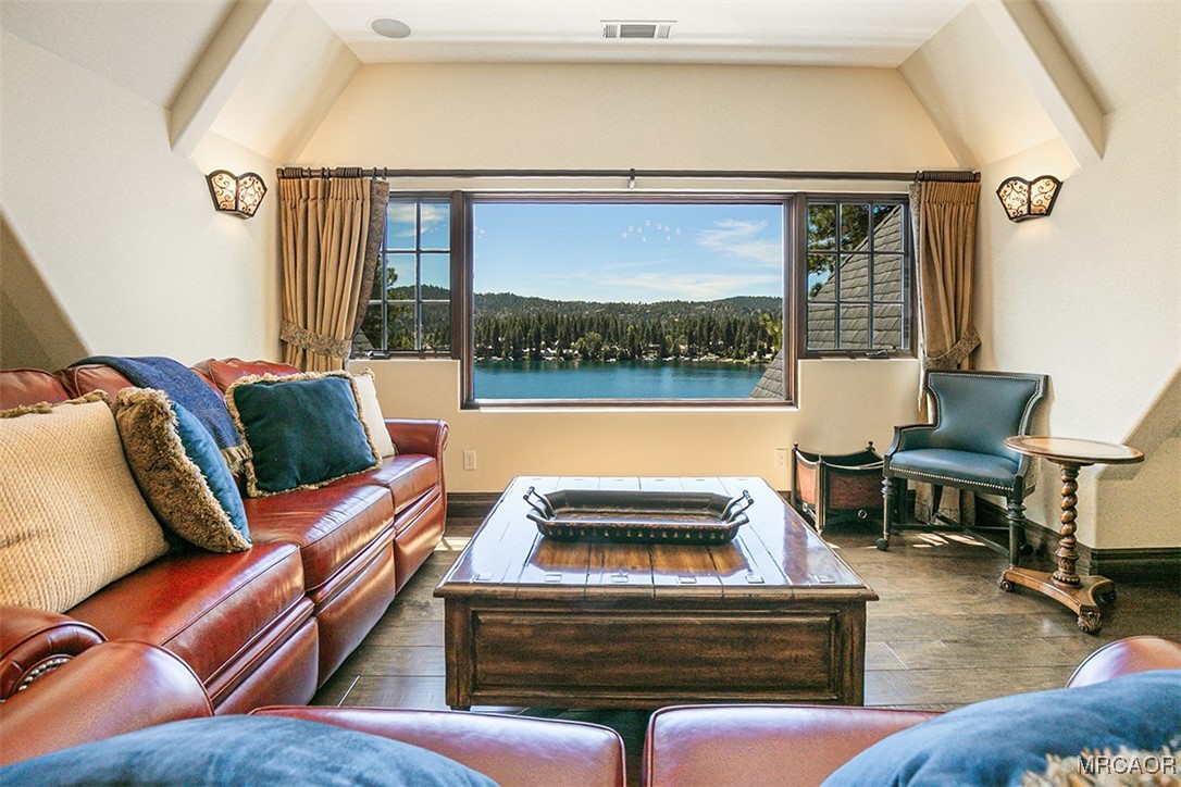 28087 North Shore Road Lake Arrowhead, CA 92352 - Photo 25 of 48 a living room with furniture and a floor to ceiling window