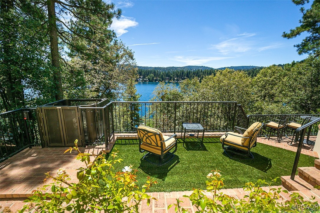 28087 North Shore Road Lake Arrowhead, CA 92352 - Photo 32 of 48 a view of a chairs in backyard of house