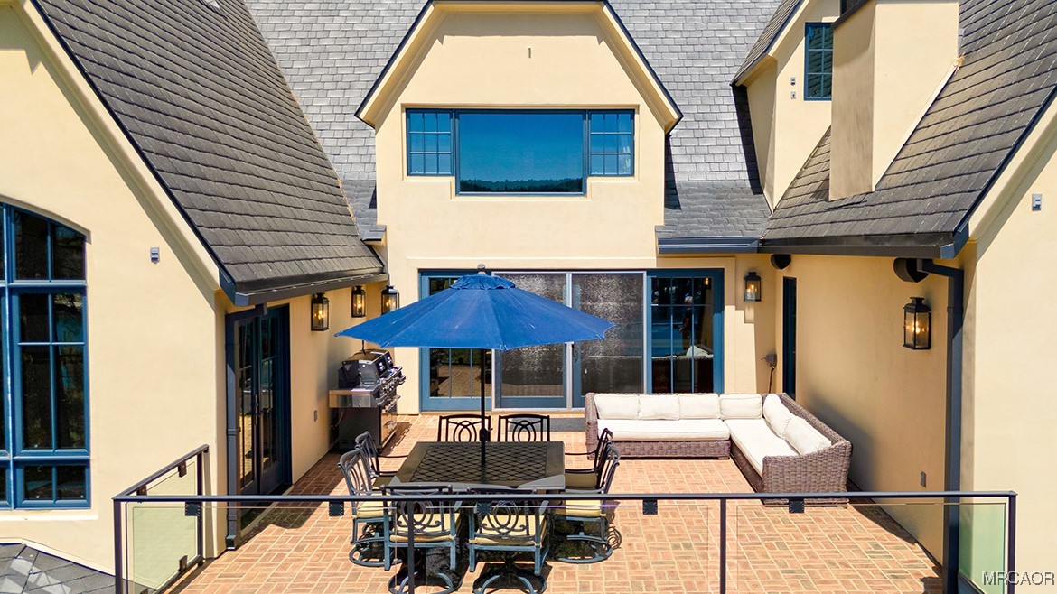 28087 North Shore Road Lake Arrowhead, CA 92352 - Photo 36 of 48 a front view of house with yard outdoor seating and barbeque oven