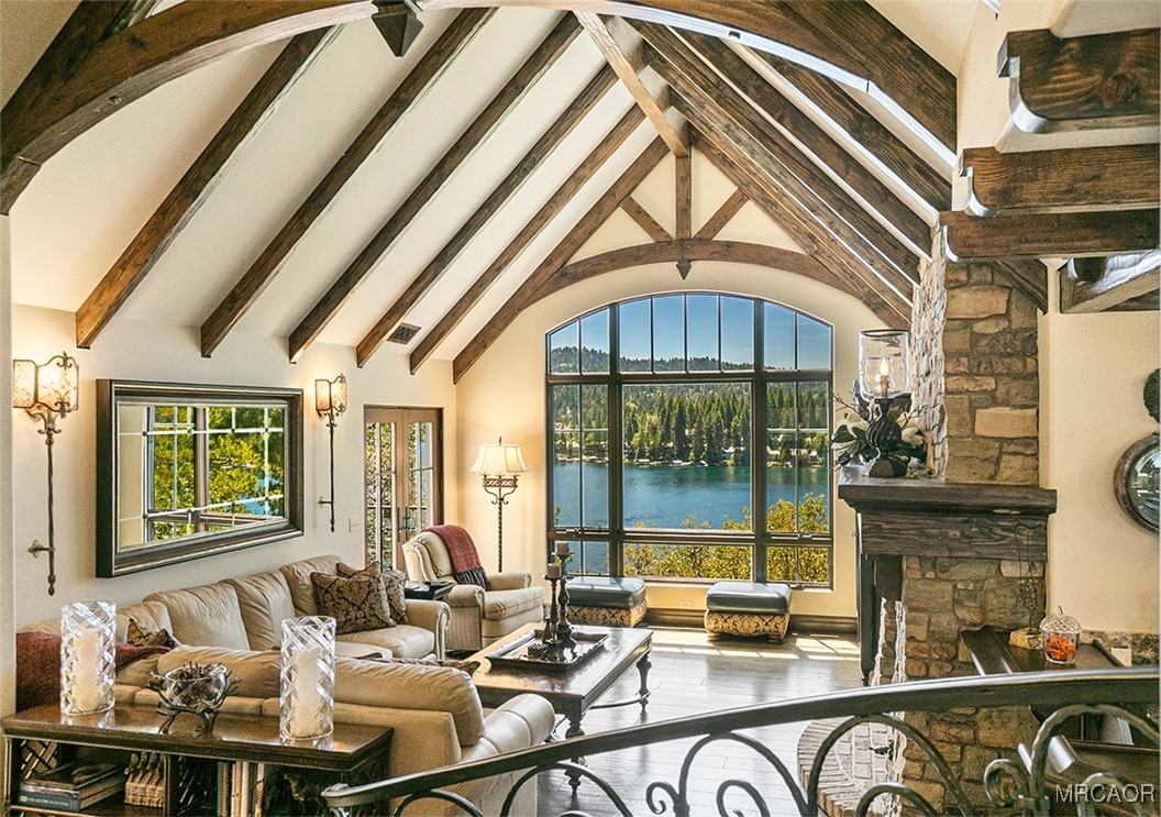 28087 North Shore Road Lake Arrowhead, CA 92352 - Photo 4 of 48 a dining room with furniture a chandelier and a rug