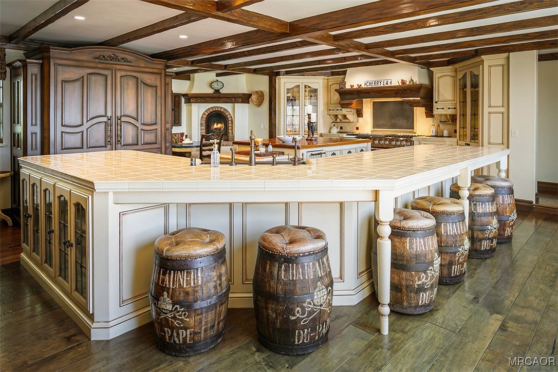 28087 North Shore Road Lake Arrowhead, CA 92352 - Photo 5 of 48 a kitchen with a sink and a table and chairs