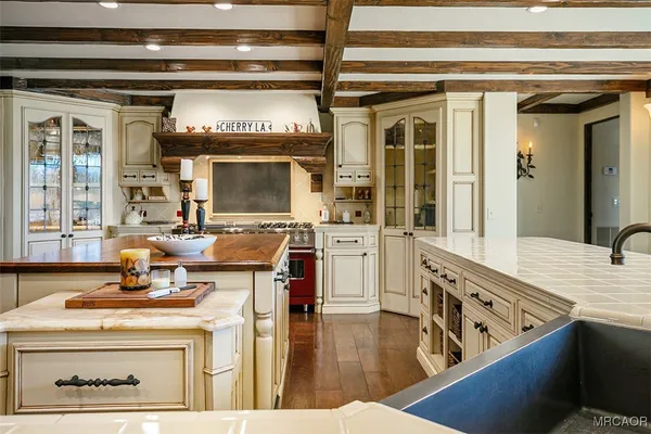 a kitchen with a stove and a refrigerator