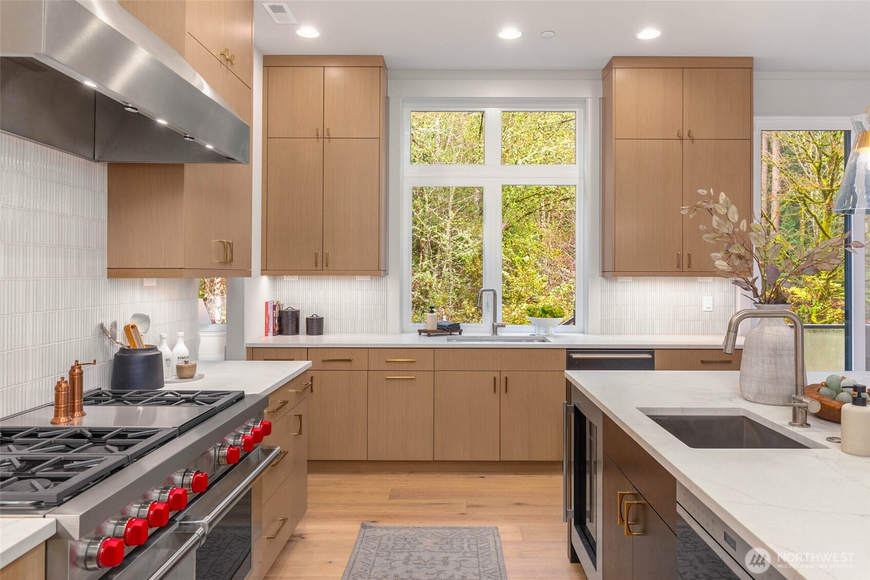 21041 Southeast 80th Street Issaquah, WA 98027 - Photo 17 of 35 a kitchen with a sink stove top oven and cabinets