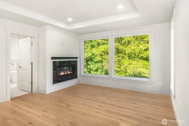 a bathroom with a tub a sink and a window