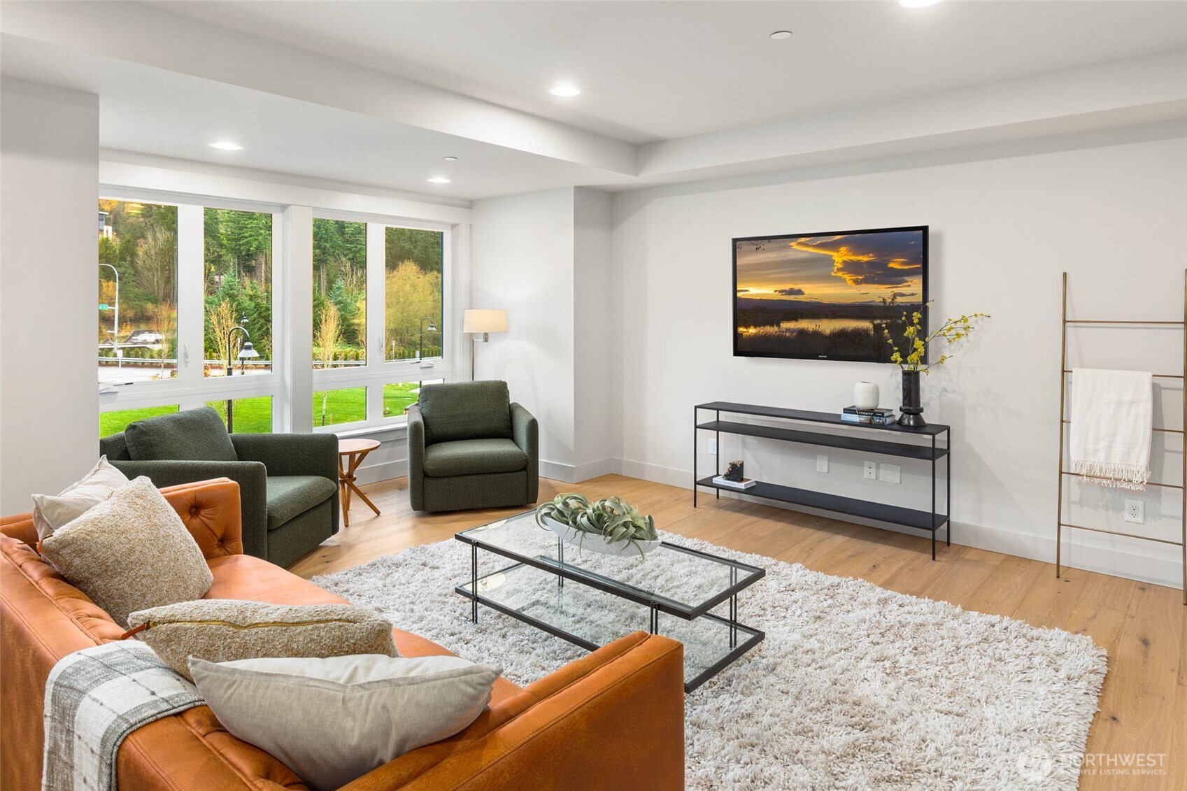 21041 Southeast 80th Street Issaquah, WA 98027 - Photo 24 of 35 a living room with furniture and a flat screen tv