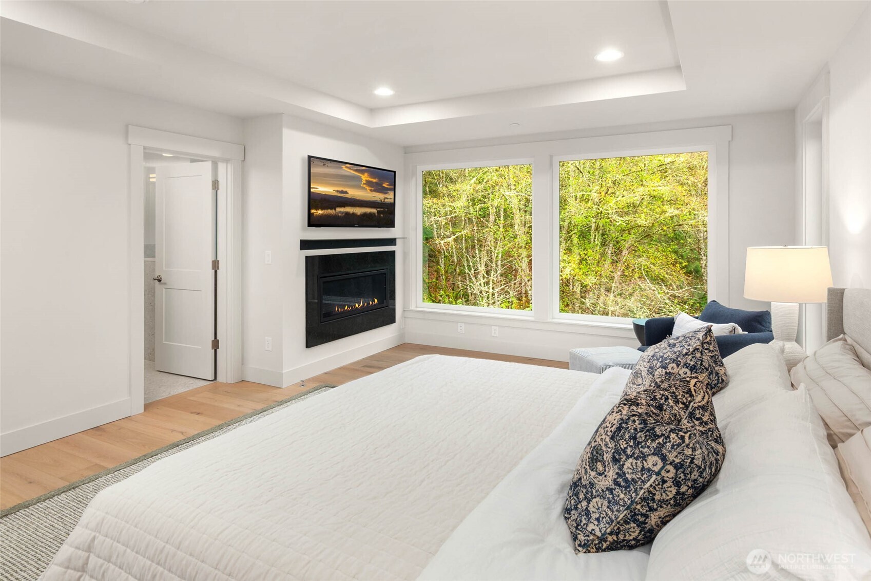 21041 Southeast 80th Street Issaquah, WA 98027 - Photo 27 of 35 a bedroom with a large bed and a large window