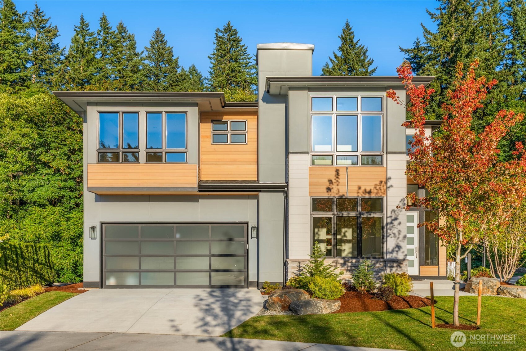 21041 Southeast 80th Street Issaquah, WA 98027 - Photo 3 of 35 a front view of a house with a yard