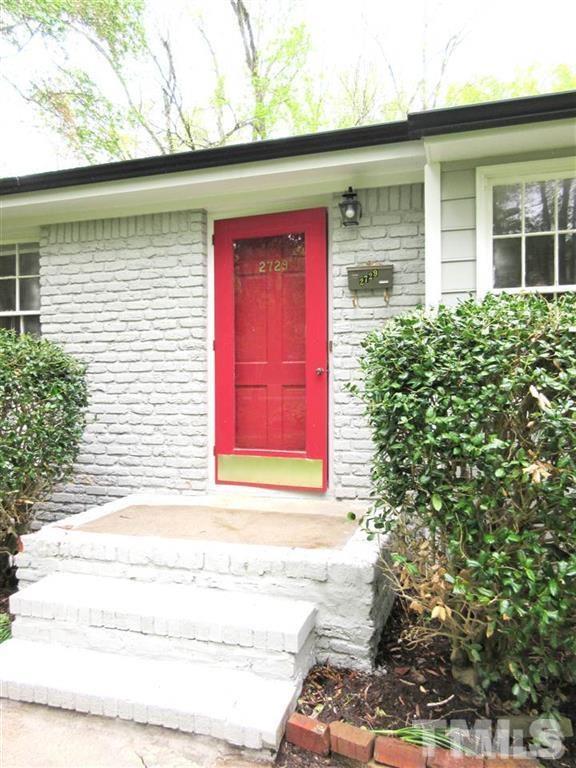 2729 Rothgeb Drive Raleigh, NC 27609 - Photo 2 of 14 a front view of a house with a yard