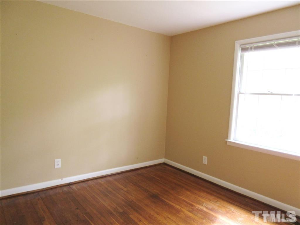 2729 Rothgeb Drive Raleigh, NC 27609 - Photo 12 of 14 wooden floor in an empty room with a window