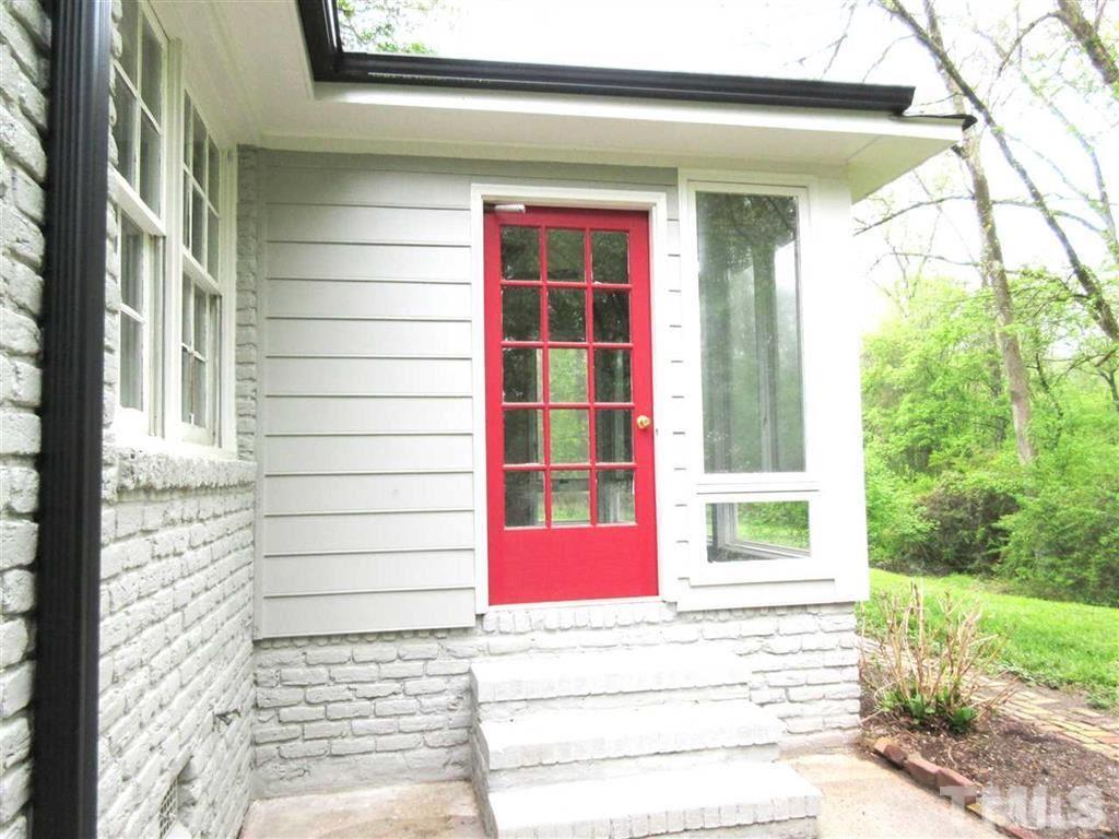 2729 Rothgeb Drive Raleigh, NC 27609 - Photo 13 of 14 a view of a door with a red door and a window