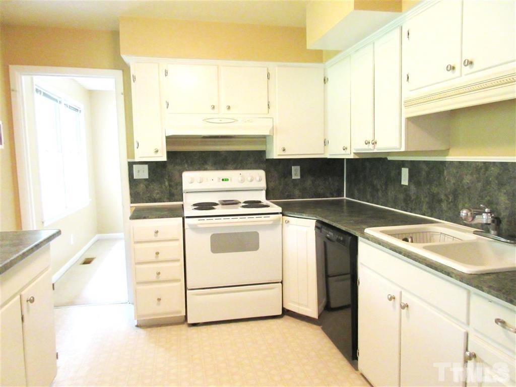 2729 Rothgeb Drive Raleigh, NC 27609 - Photo 8 of 14 a kitchen with a stove and a sink