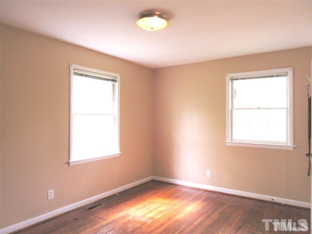 2729 Rothgeb Drive Raleigh, NC 27609 - Photo 9 of 14 an empty room with a window