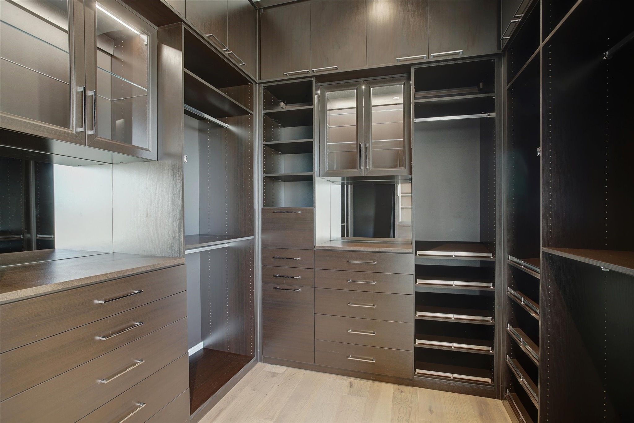 1211 Caroline Street, Unit 2002 Houston, TX 77002 - Photo 15 of 31 Custom California closet in the primary bedroom.
