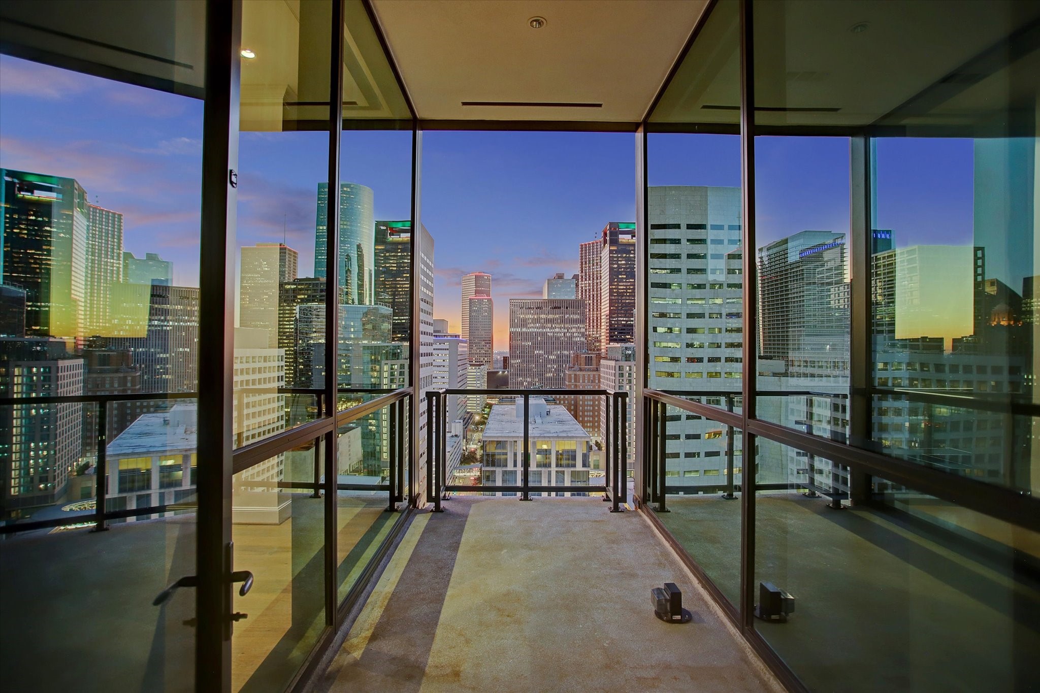 1211 Caroline Street, Unit 2002 Houston, TX 77002 - Photo 2 of 31 Covered balcony perched above Houston's skyline.
