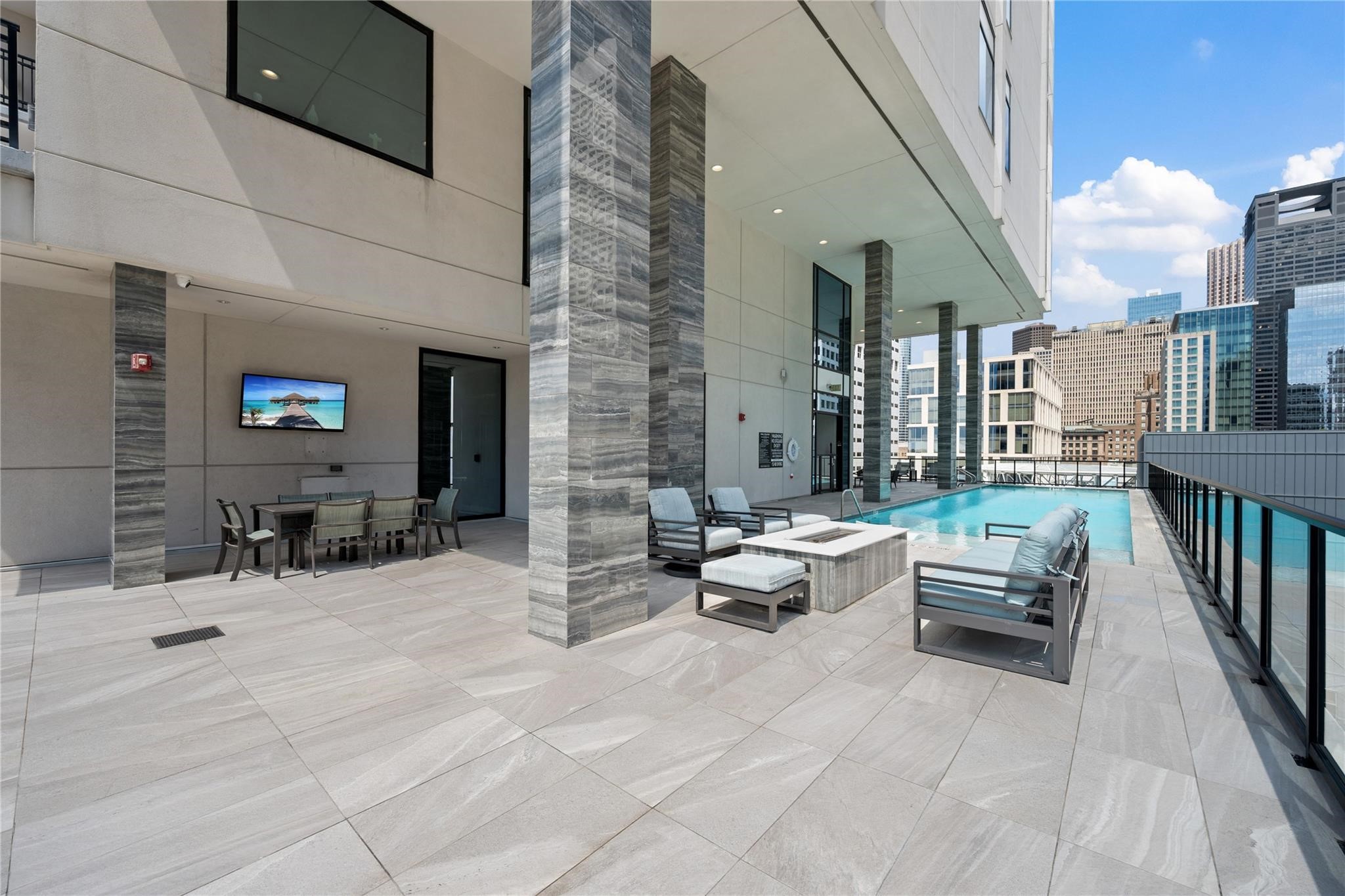 1211 Caroline Street, Unit 2002 Houston, TX 77002 - Photo 21 of 31 Starlight pool, fire pit and grill area on the 8th floor.