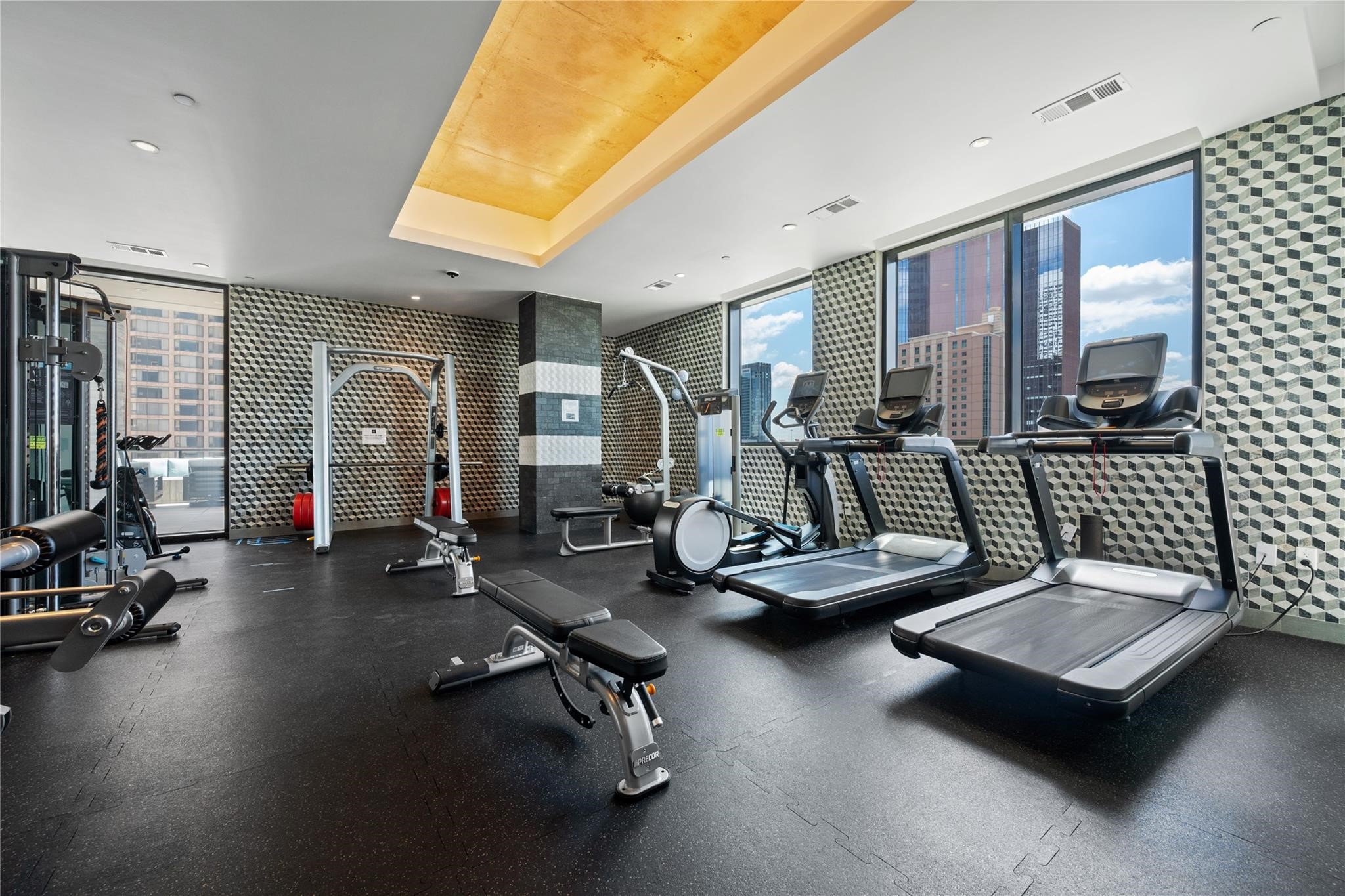 1211 Caroline Street, Unit 2002 Houston, TX 77002 - Photo 22 of 31 Fitness center includes treadmills, weights and an elliptical machine.