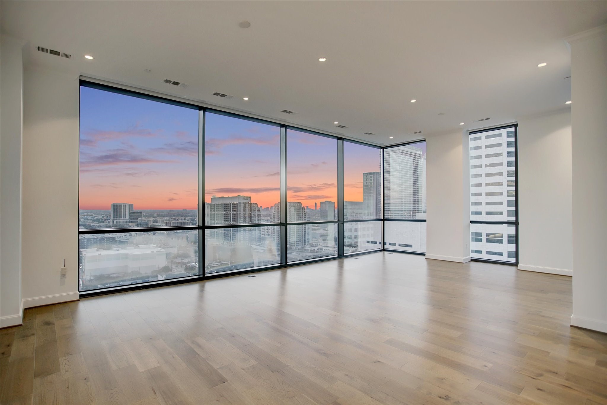 1211 Caroline Street, Unit 2002 Houston, TX 77002 - Photo 8 of 31 Soaring windows are the highlight of the living/dining area
