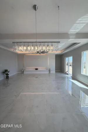 a kitchen with granite countertop white cabinets and stainless steel appliances