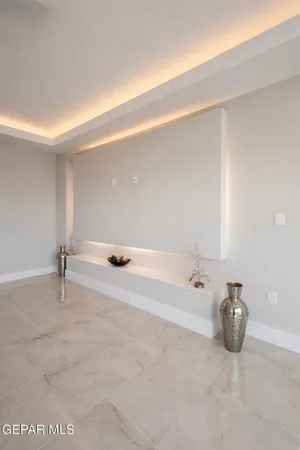 a bedroom with a bed and a ceiling fan