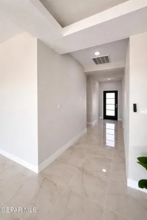 a bedroom with a bed and a ceiling fan