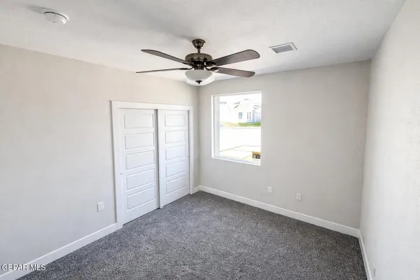 a view of an empty room and closet