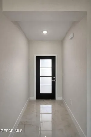 a spacious bathroom with a double vanity sink a mirror and a shower