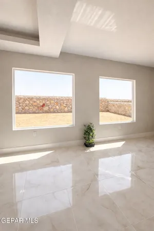 a view of a livingroom with furniture and a window