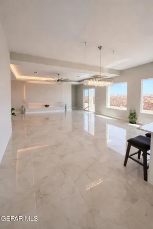 a kitchen with kitchen island a sink stainless steel appliances and a counter top space
