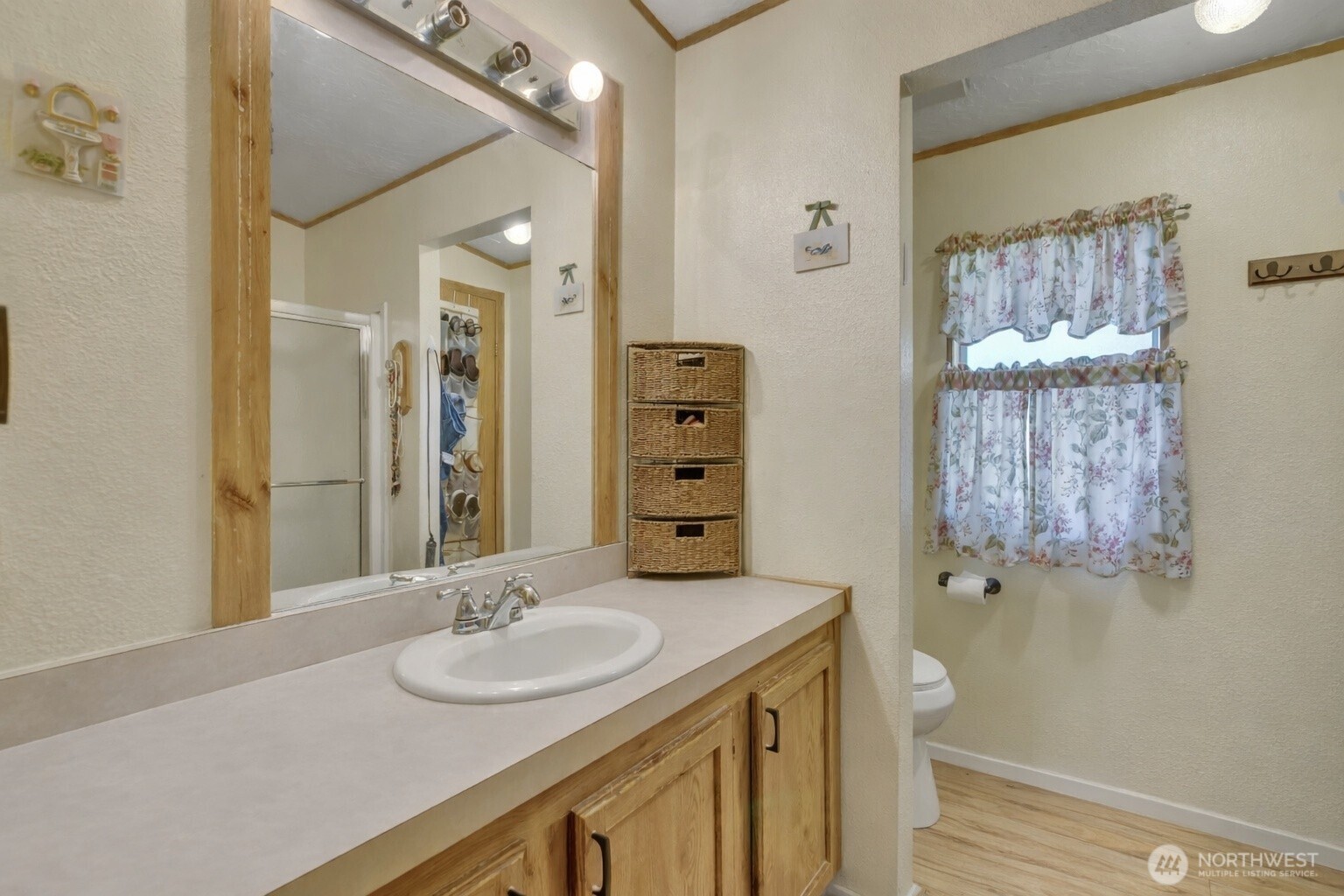 1507 286th Street East Roy, WA 98580 - Photo 14 of 22 a bathroom with a double vanity sink and a mirror
