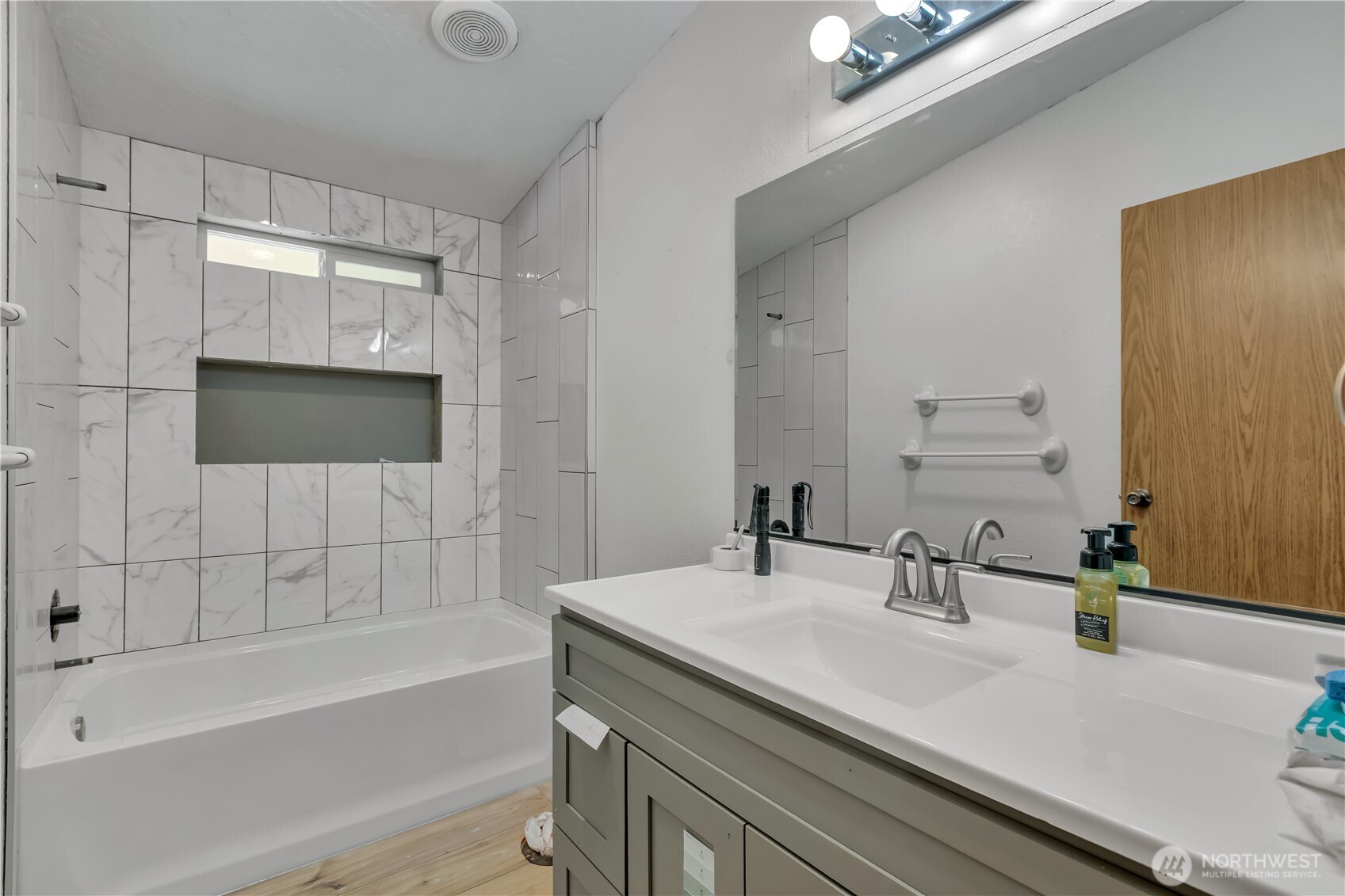 1507 286th Street East Roy, WA 98580 - Photo 16 of 22 a bathroom with a sink double vanity granite tub shower and a mirror