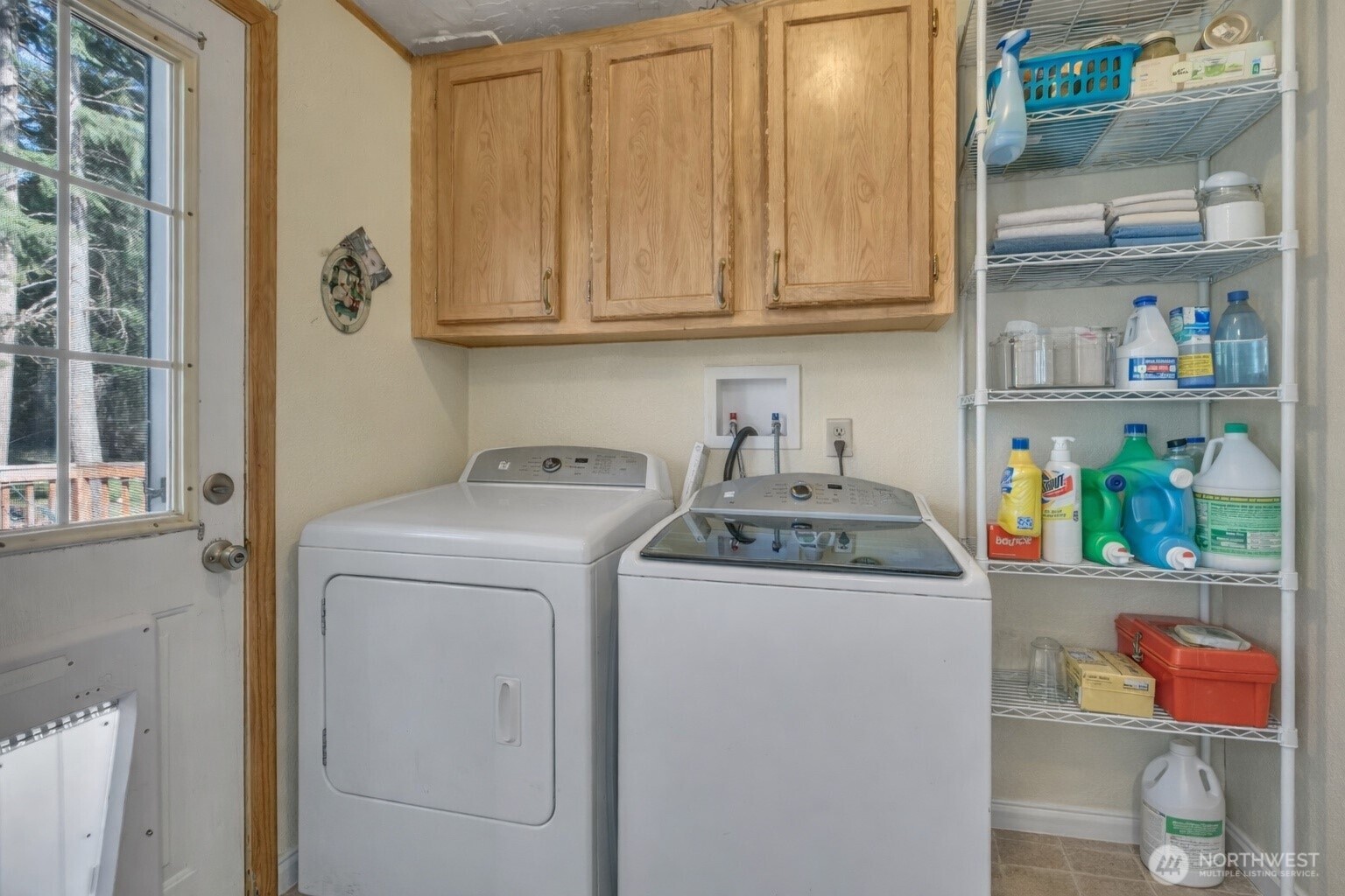 1507 286th Street East Roy, WA 98580 - Photo 17 of 22 a utility room with fridge dryer and washer