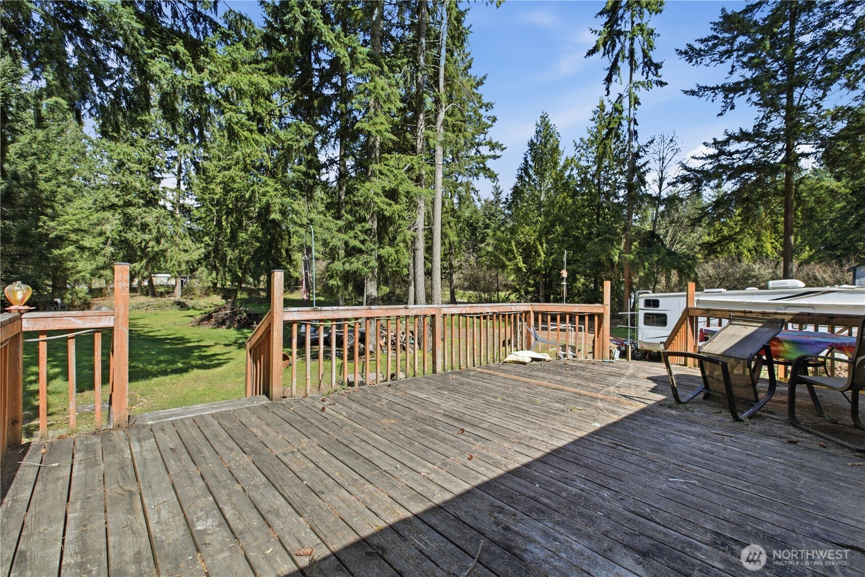 1507 286th Street East Roy, WA 98580 - Photo 18 of 22 a balcony with wooden floor table and chairs