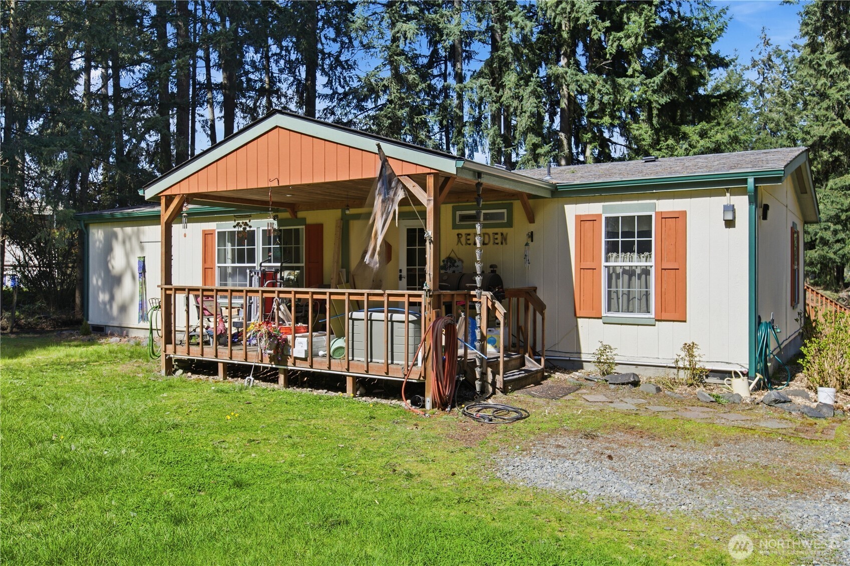 1507 286th Street East Roy, WA 98580 - Photo 3 of 22 a front view of a house with garden