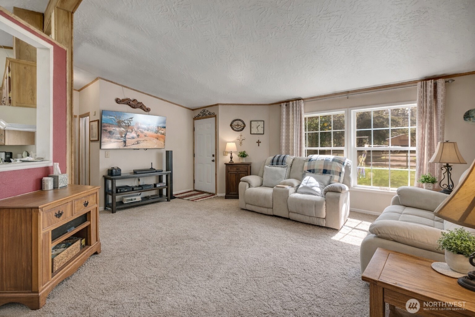 1507 286th Street East Roy, WA 98580 - Photo 5 of 22 a living room with furniture and a flat screen tv