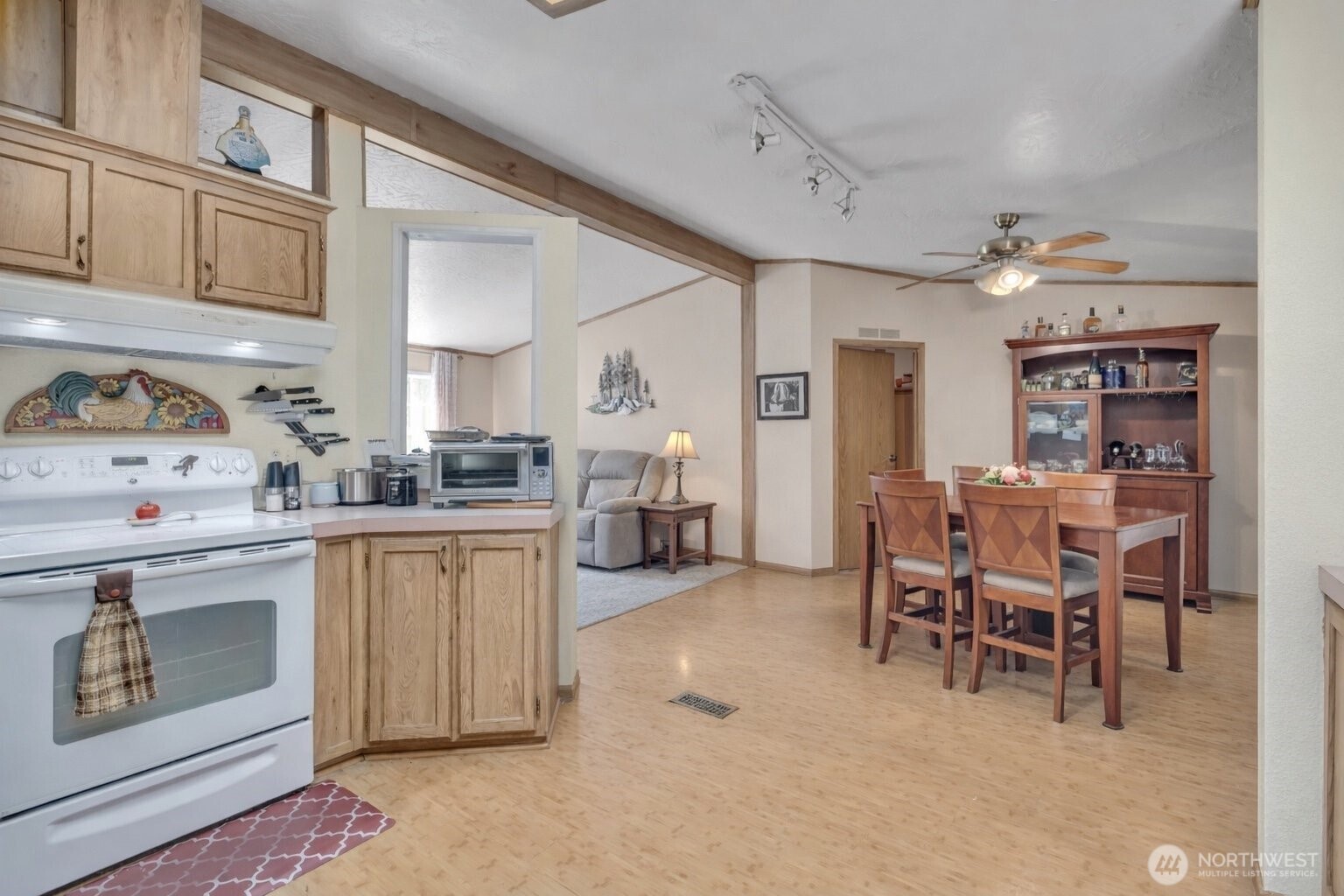 1507 286th Street East Roy, WA 98580 - Photo 9 of 22 a kitchen with cabinets and chairs