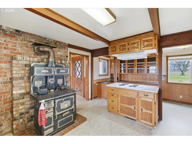 a kitchen with stainless steel appliances granite countertop a stove and a refrigerator