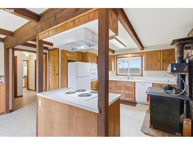 a dining room with furniture and a window