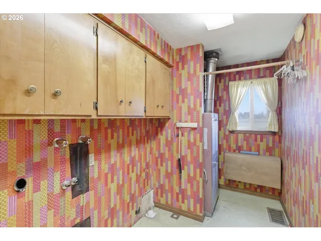 a bathroom with a shower and a sink