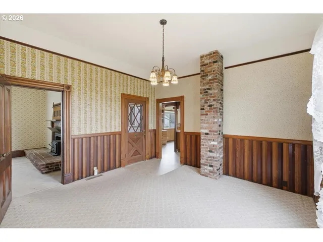 a view of a room with furniture window and a chandelier