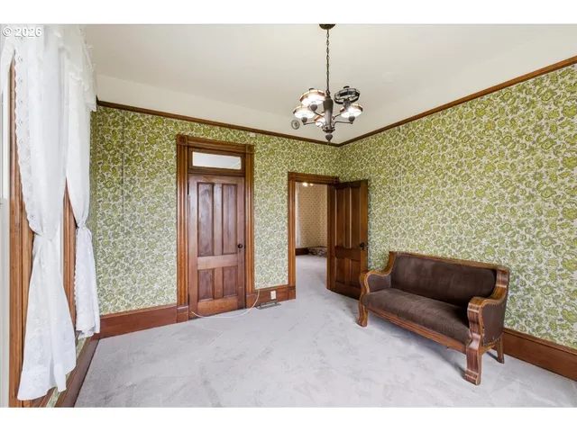 a view of living room with furniture and chandelier