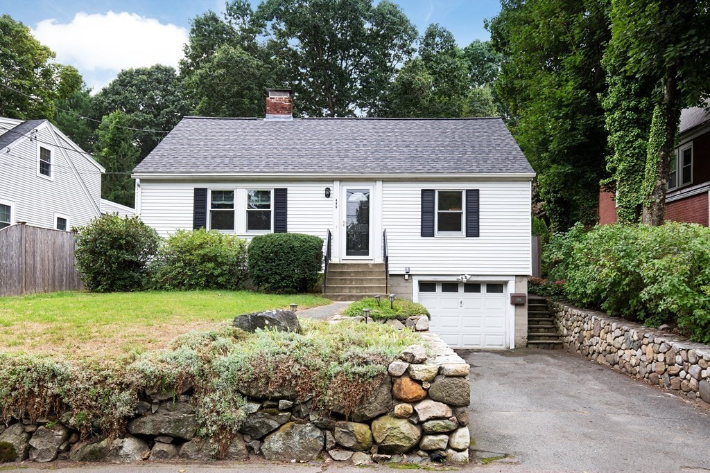496 Marrett Road Lexington, MA 02421 - Photo 1 of 25 a front view of a house with a yard and garage