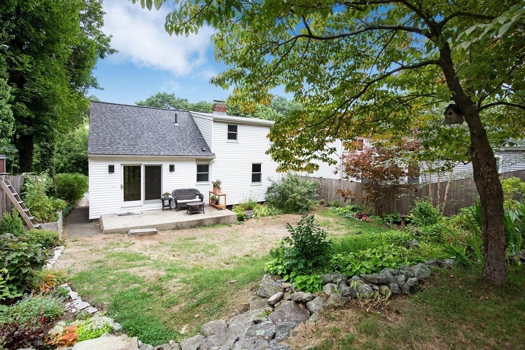 496 Marrett Road Lexington, MA 02421 - Photo 17 of 25 a view of a house with sitting area and garden