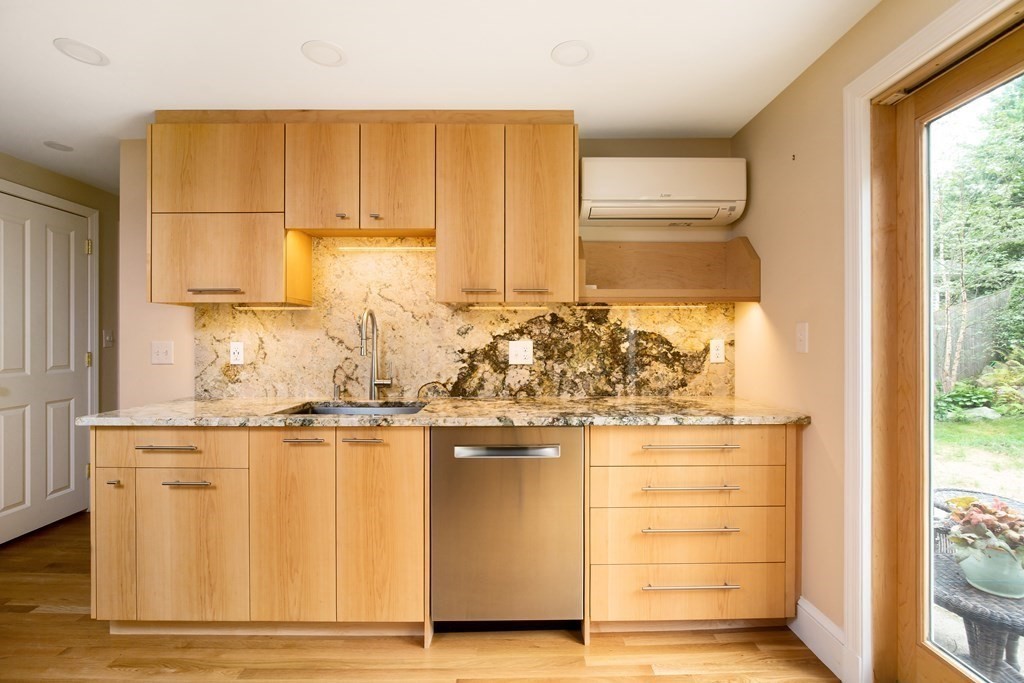 496 Marrett Road Lexington, MA 02421 - Photo 5 of 25 a view of a kitchen with wooden floor and a window