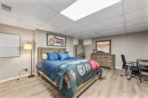 a bedroom with a bed and a table in it