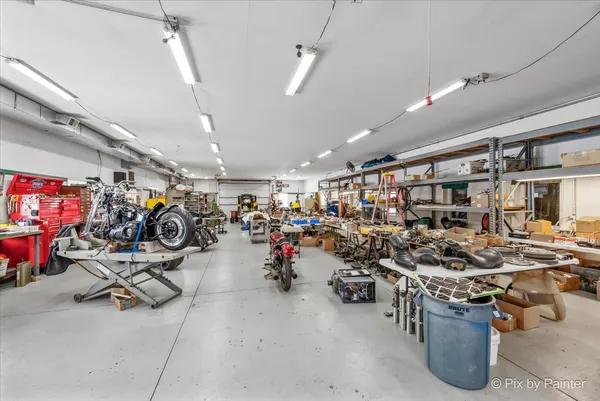 a view of a garage with a bike and car