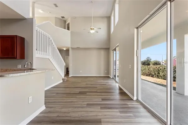 a view of a hallway view with wooden floor and staircase
