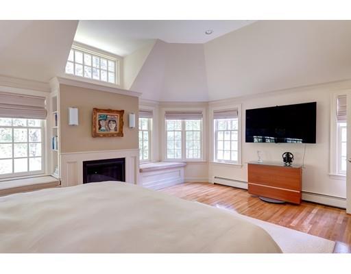 47 Draper Road Wayland, MA 01778 - Photo 11 of 26 a living room with flat screen tv a window and a flat screen tv