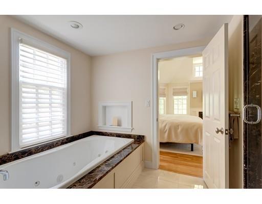 47 Draper Road Wayland, MA 01778 - Photo 15 of 26 a living room with a bed furniture and a window