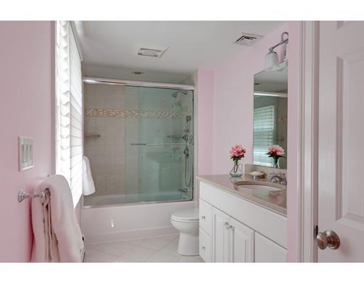 47 Draper Road Wayland, MA 01778 - Photo 17 of 26 a bathroom with a granite countertop sink a toilet a mirror and shower